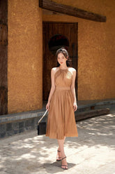 Halter Neck Pleated Silk Dress with Ruched Waist and Flowing Midi Skirt